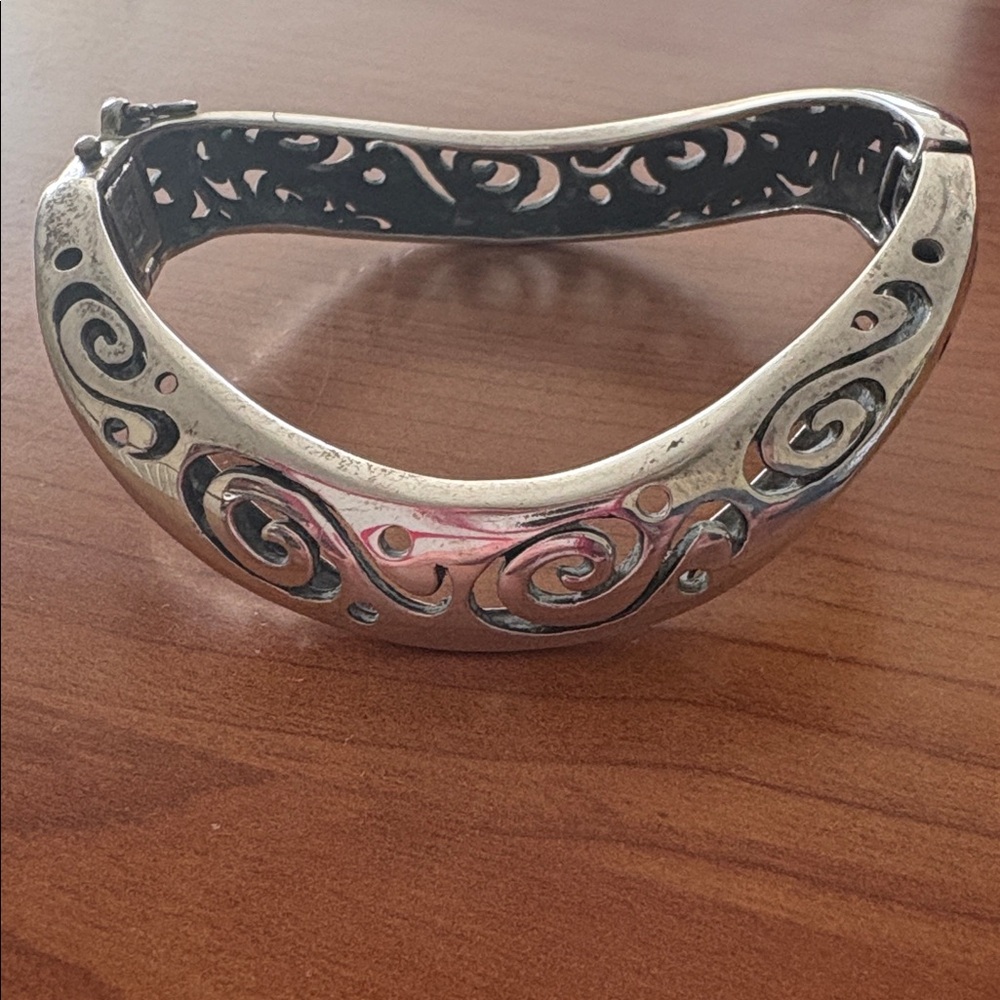 Intricate Patterned Hinged Silver Bracelet with Unique Safety Clasp